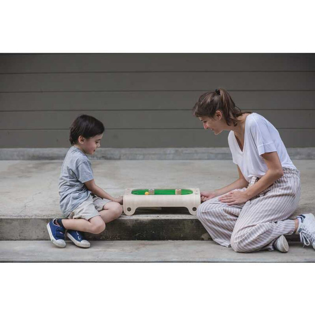 Kid playing PlanToys Magnetic Board Game