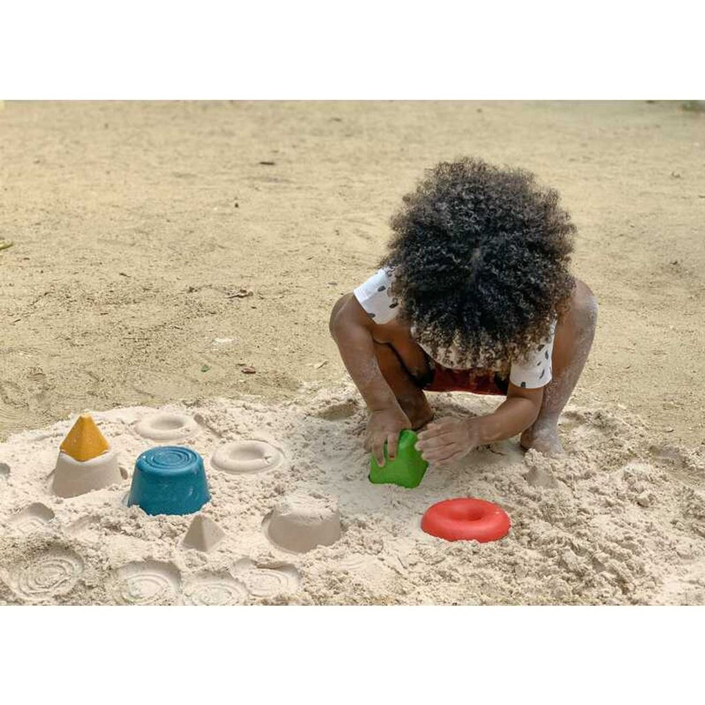 Kid playing PlanToys Creative Sand Play